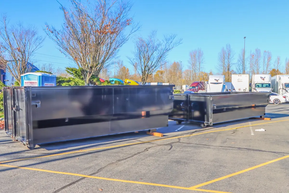 Professional dumpster rental service with roll-off container on residential driveway in San Ramon